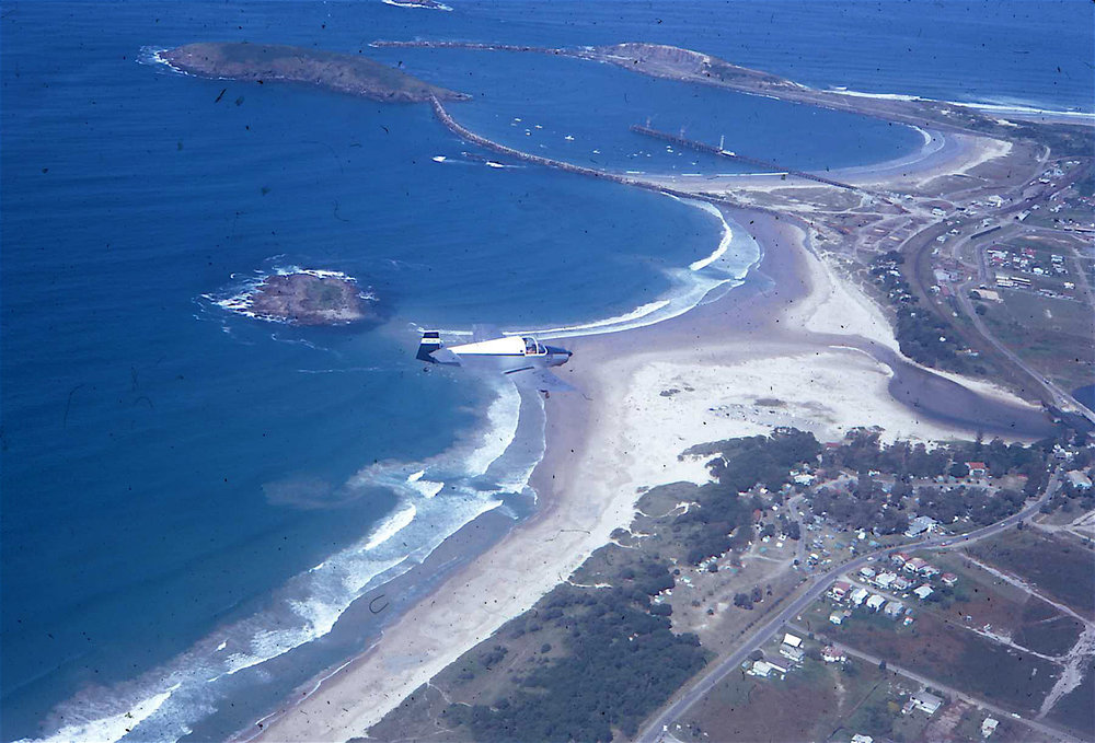 Jodel flying over Coffs Harbour, 1968
