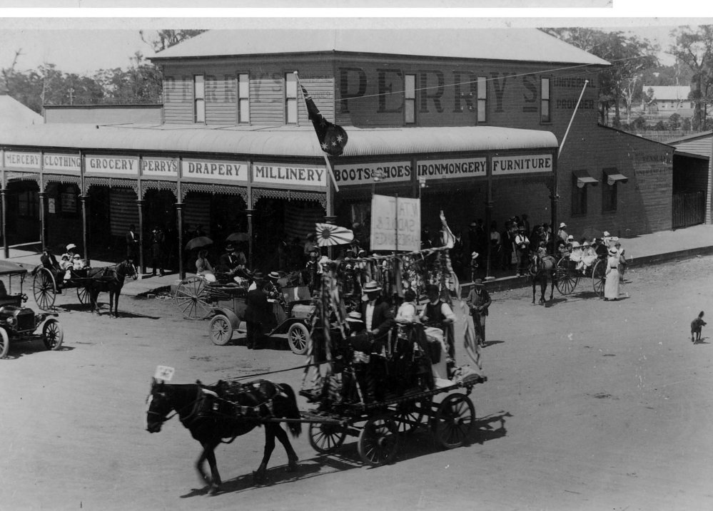 Procession Parade rounding the Perry Department Store, November 1918