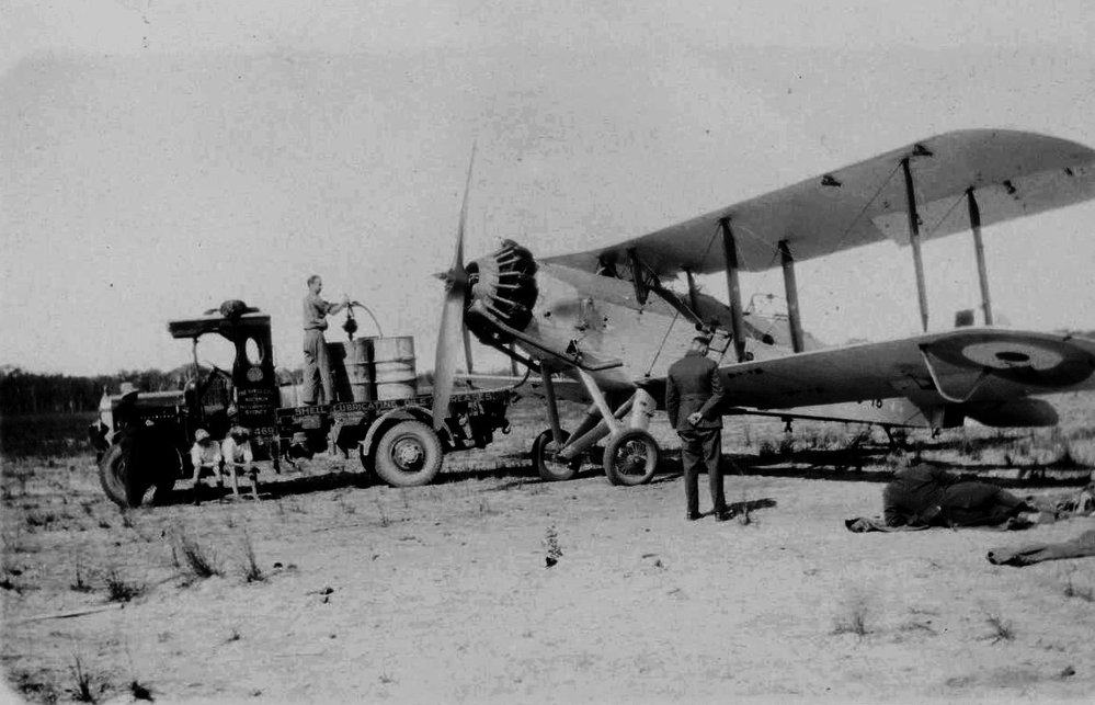  David Nicol refuelling an RAAF Westland Wapiti aeroplane at Coffs Harbour Aerodrome, 1930s