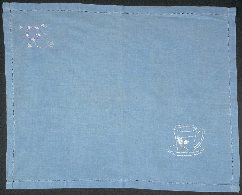 Embroidered place mat or tray cloth