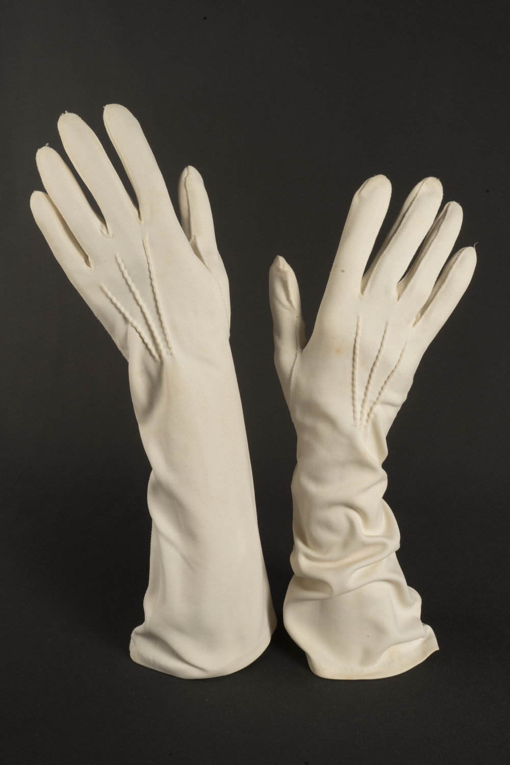 Pair of cream evening gloves