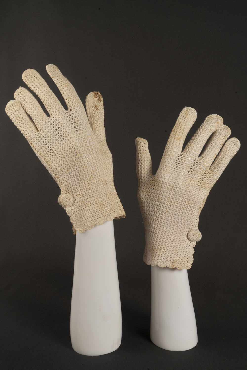 Pair of cream crocheted gloves