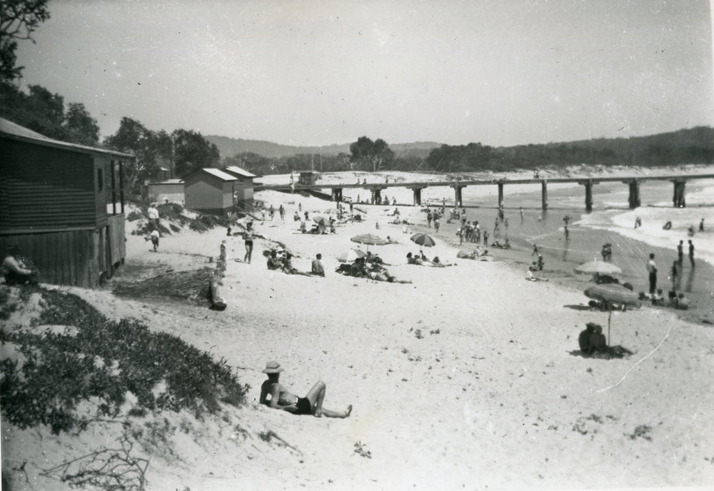 Beachgoers scattered on Woolgoolga Beach, 1960s
