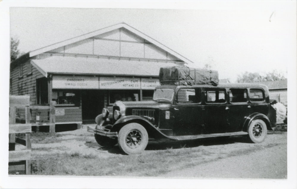Touring coach outside the smallgoods shop of R.A. Waterhouse, mid 1930s
