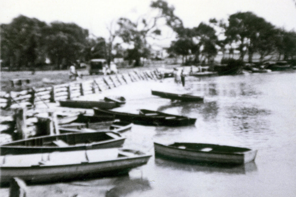 Boats on river bank, Red Rock