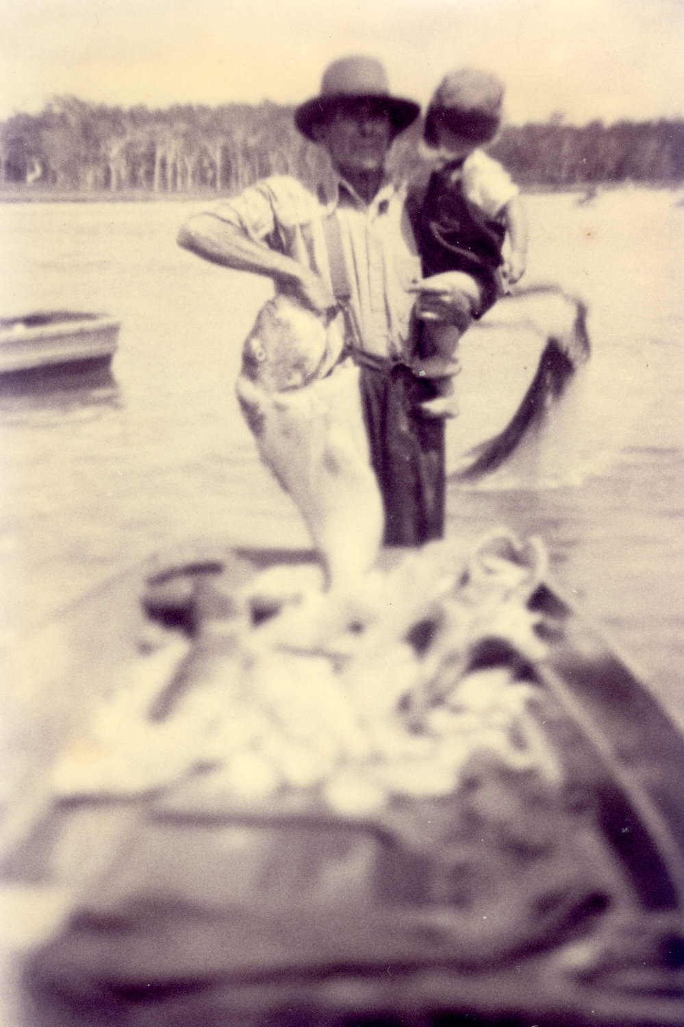 2 Men in boat with fish Red Rock 1950
