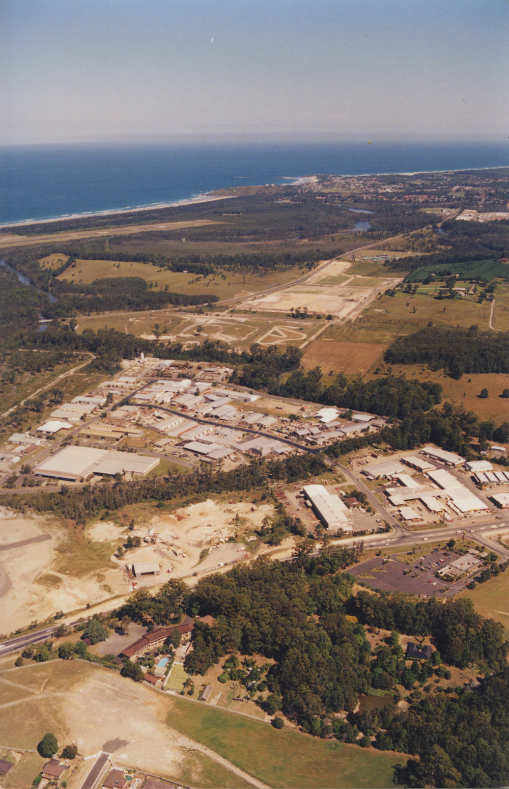 Aerial view of Cook Drive industrial estate of Coffs Harbour, 1990s
