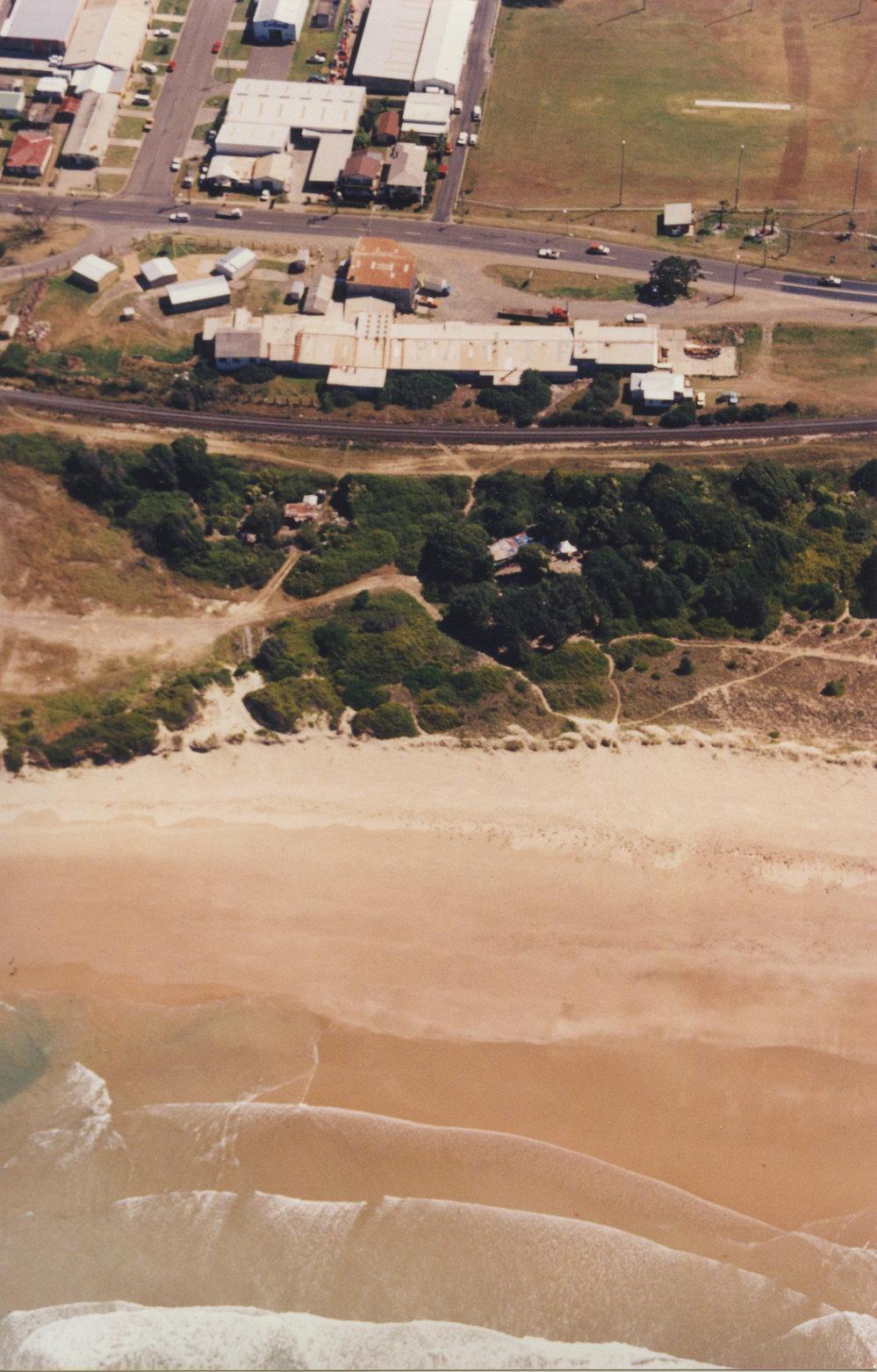 Aerial view of Pacific Plywood mill on Orlando Street near Coffs Harbour Jetty, 1990s