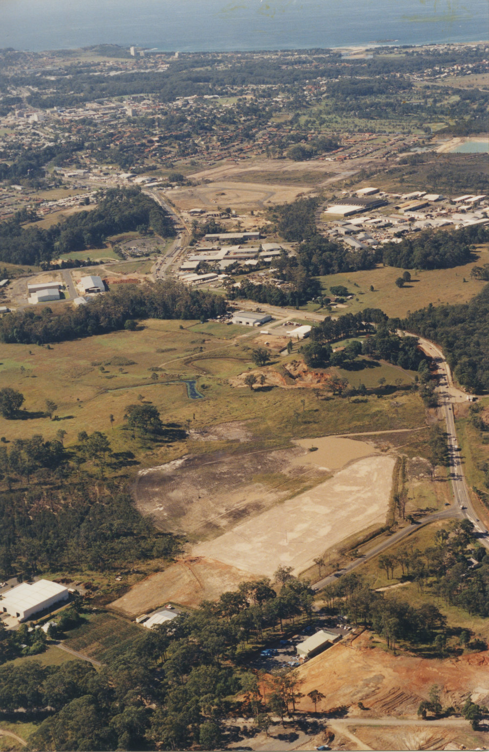 Aerial view of the Pacific Highway through southern Coffs Harbour, 1990s