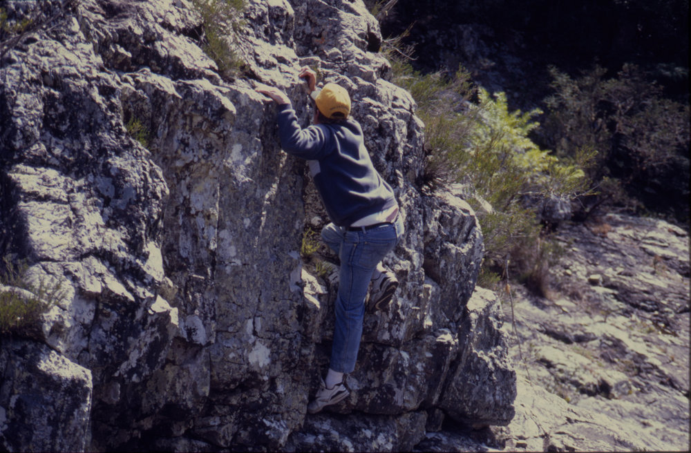 Man climbing rock wall