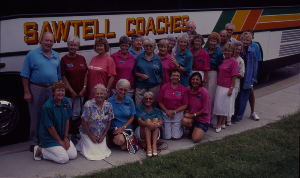 Tour group beside a Sawtell Coaches bus