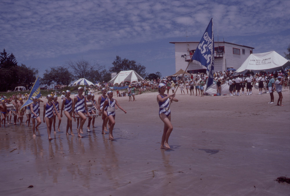 Coffs Harbour Junior Surf Life Saving Club march at Woolgoolga Beach, March 1989