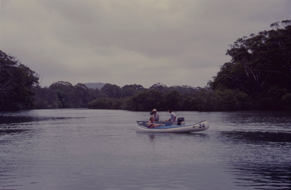 Kayak and tinnie on Coffs Creek