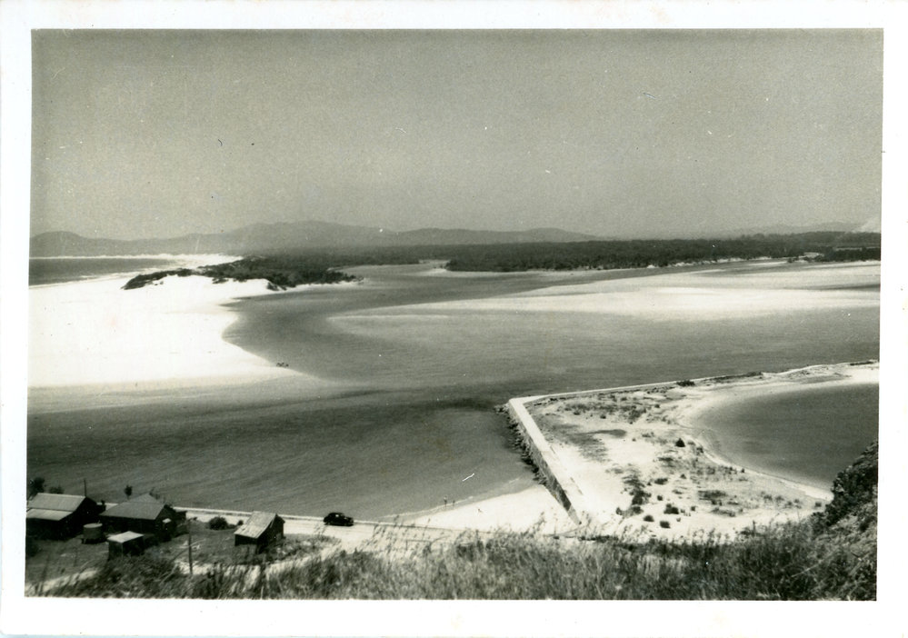 Beach houses and estuary, c. 1950s