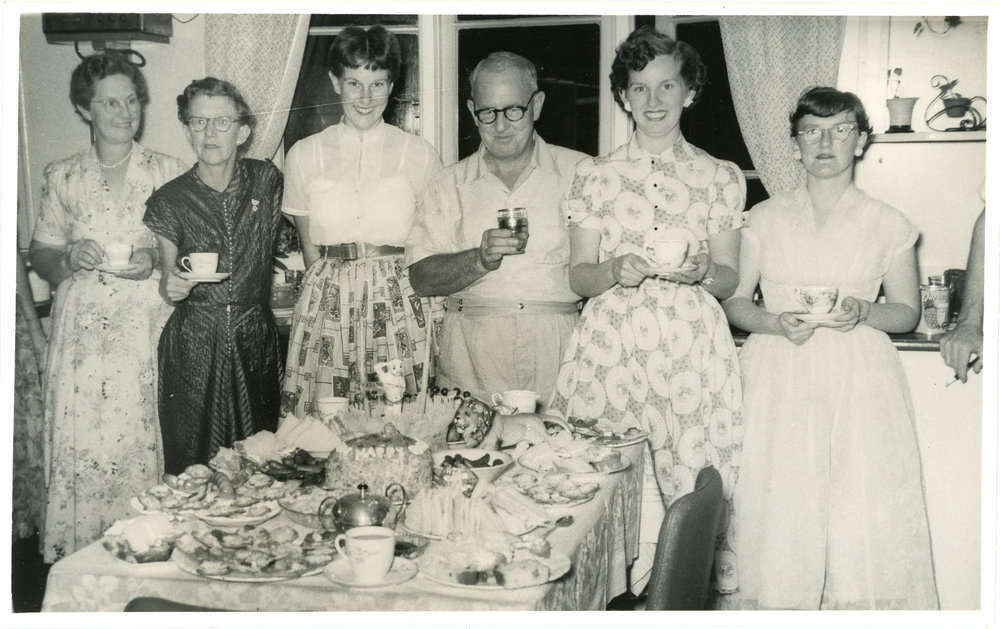 Jack Gerard admires his birthday cake, c. 1950s