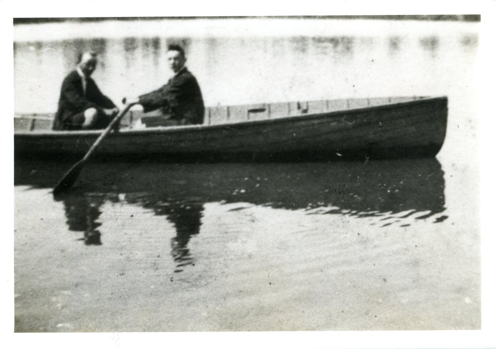 Two men in a rowboat, c. 1950s