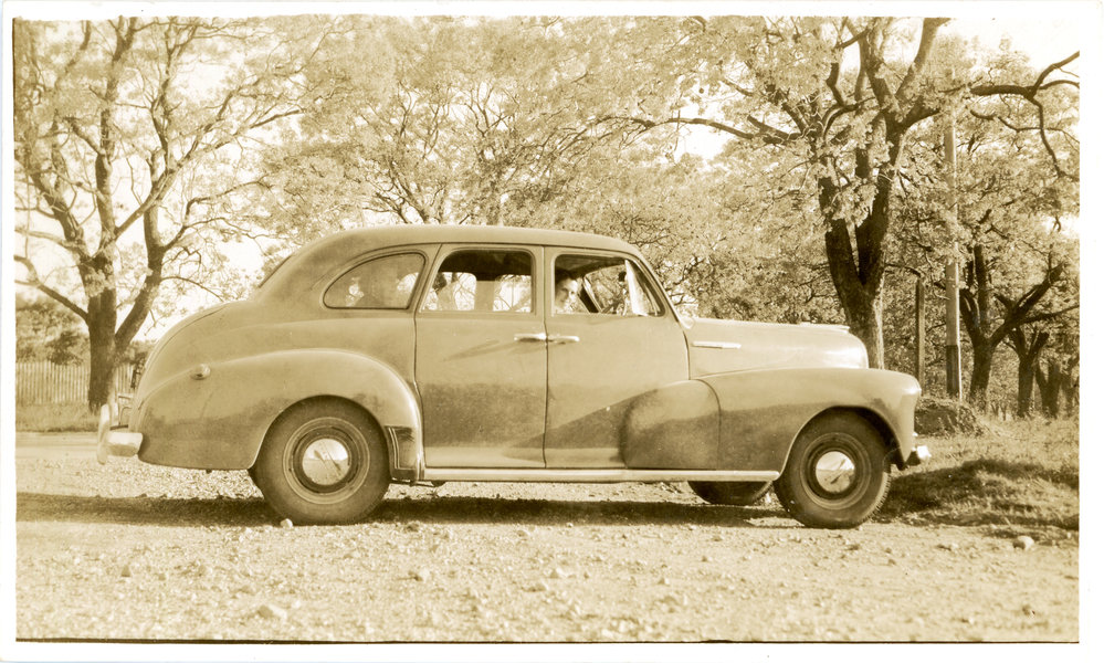 Marie Hunt in Chevy with two passengers, c. 1950s