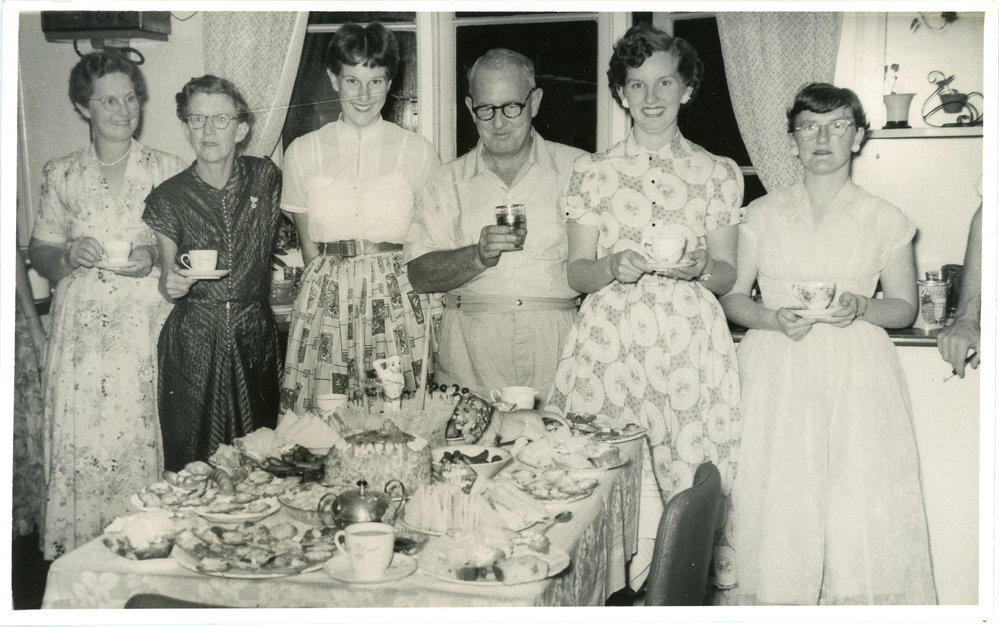 Jack Gerard admires his birthday cake, c. 1950s