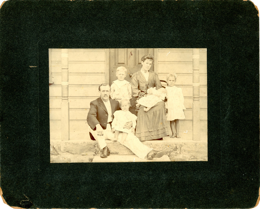 Family of six on the steps