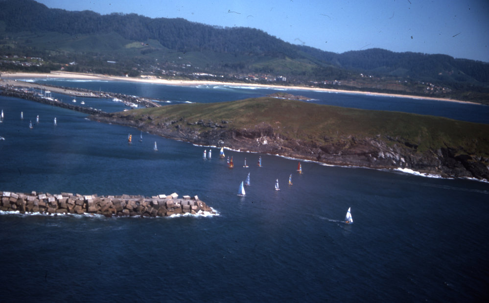 Hobie catamarans sail past the southern breakwall, 1977