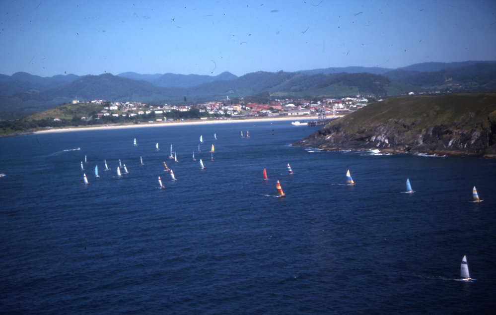 Hobie catamarans sail past Muttonbird Island, 1977