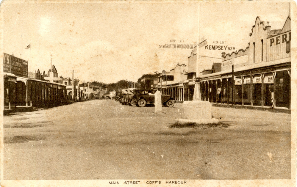 A road sign in the middle of the Grafton and High Streets intersection, c. 1925