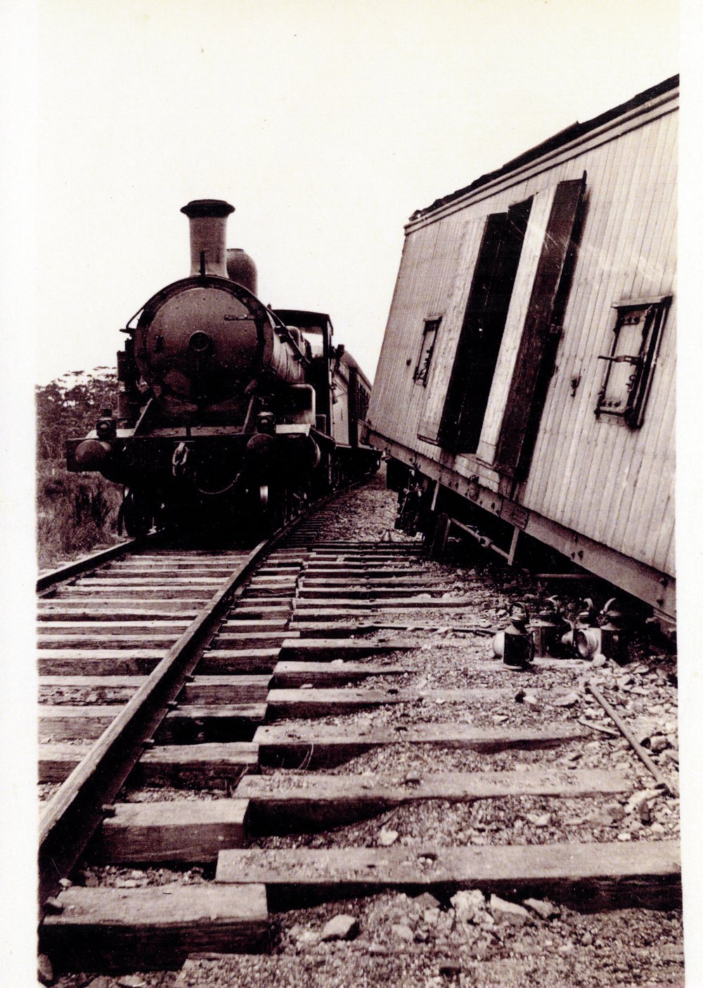 A passenger train eases by the derailment, 1924