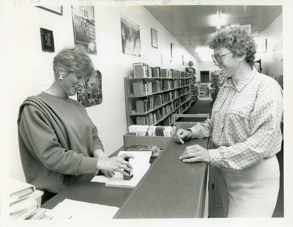 Checking out a book from the Coffs Harbour Library, 31 August 1988