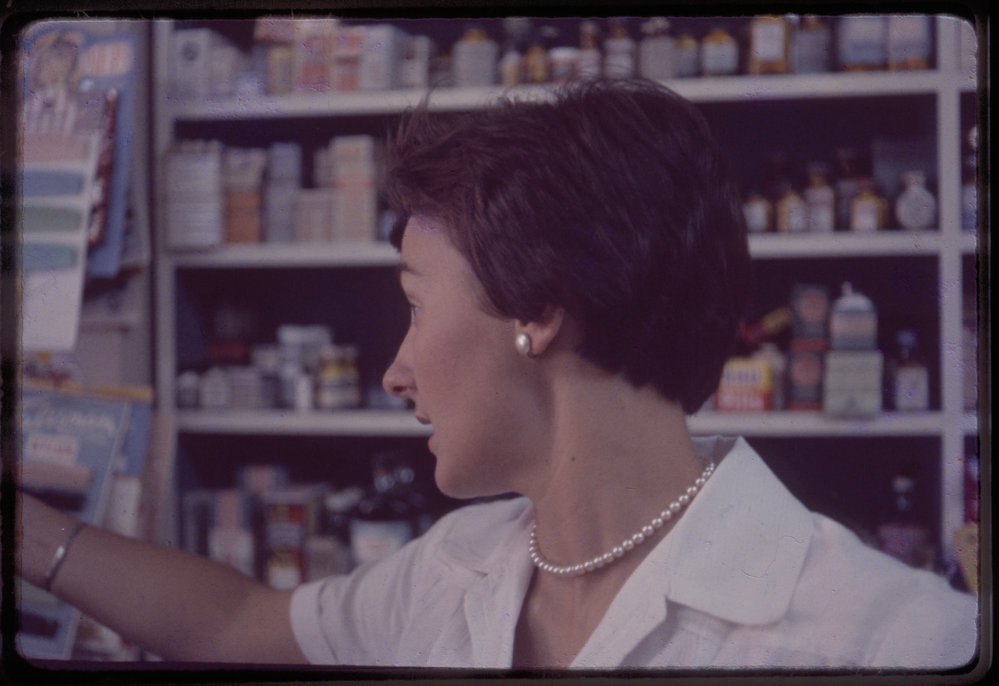 Pharmacy assistant in Forsyth's pharmacy, c. 1960s