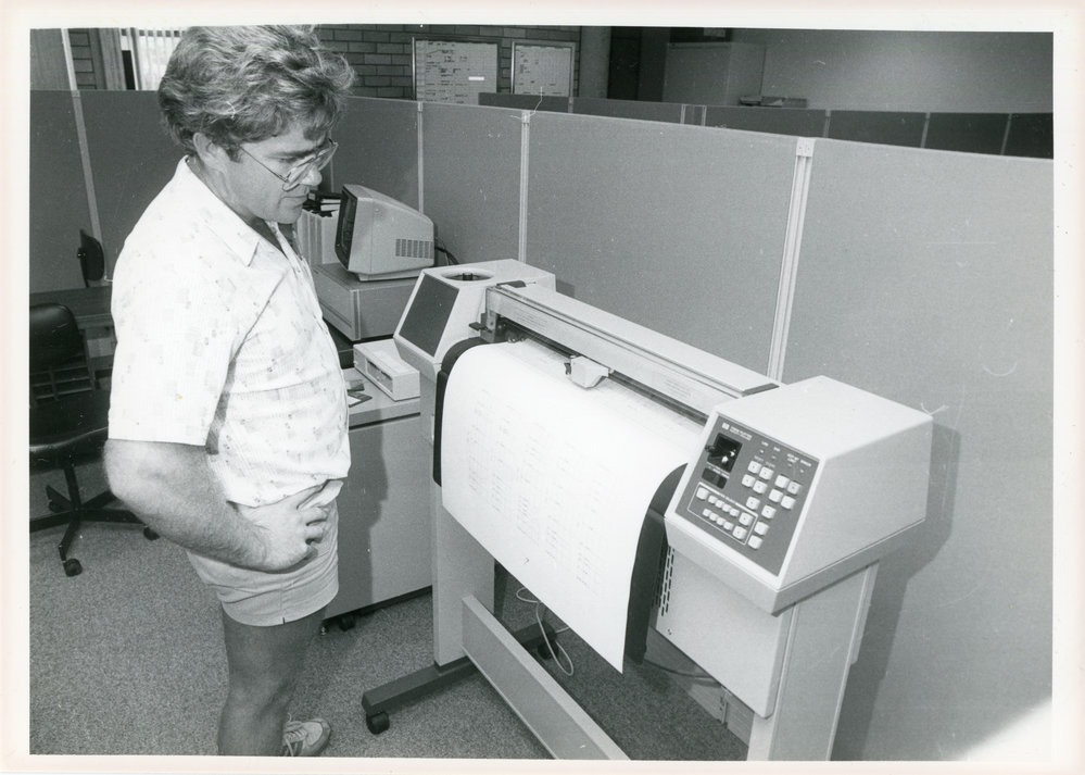 Council Engineer Ray Hallgarth with plotter, 1985