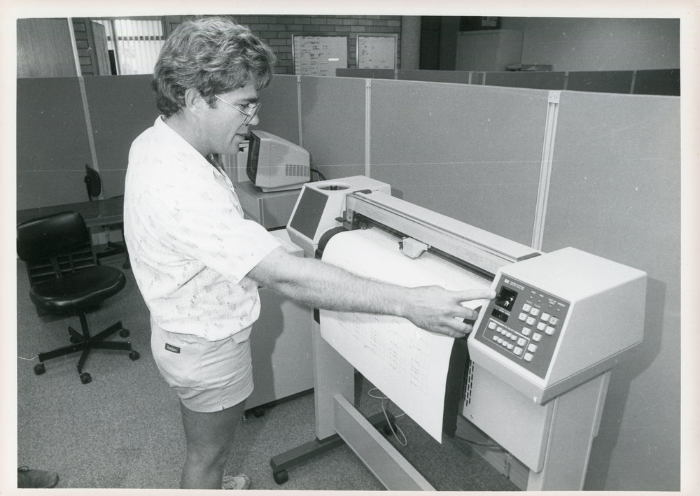Engineer Ray Hallgarth with plotter, 1985