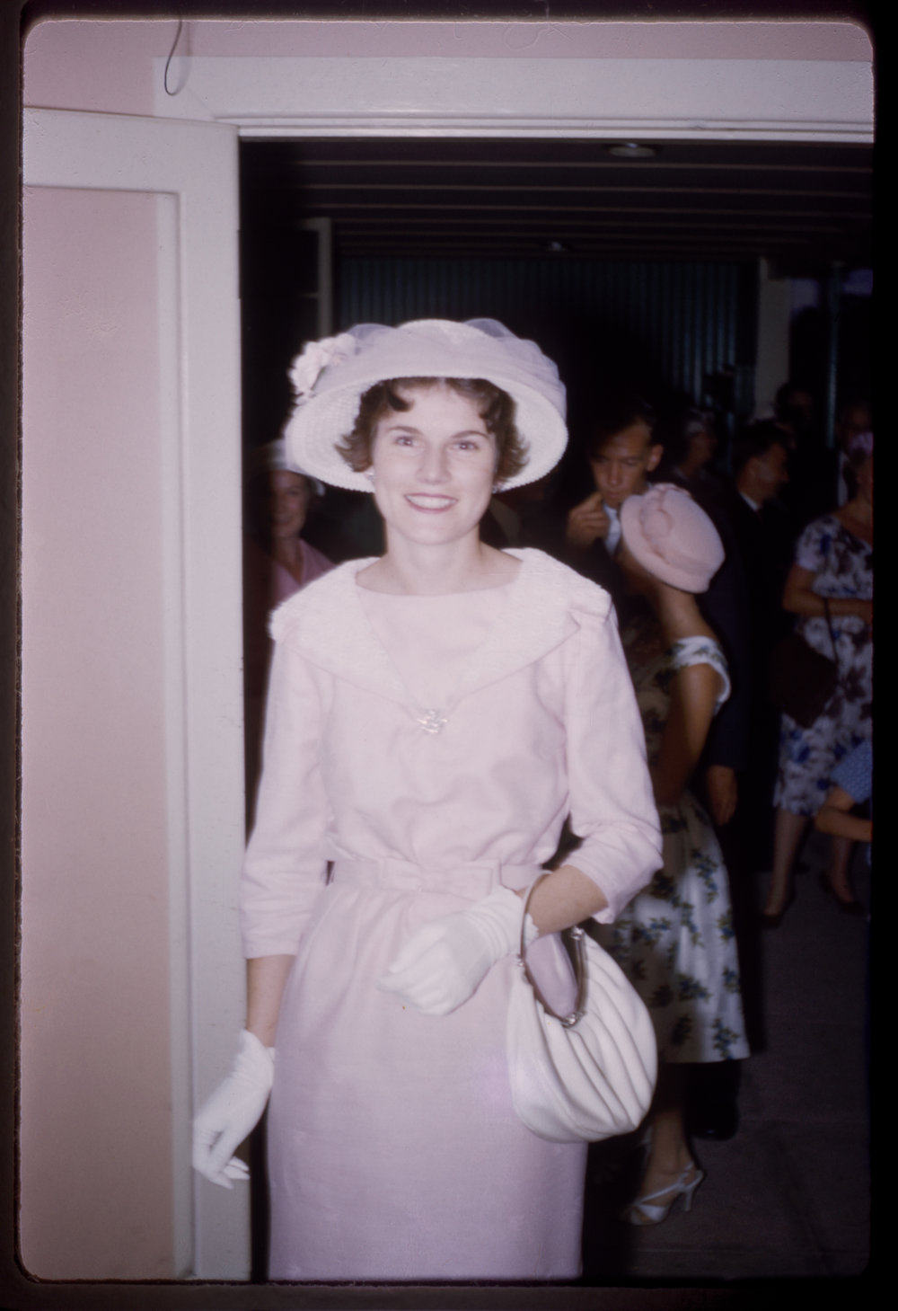 Bride in going away outfit, c. 1960s