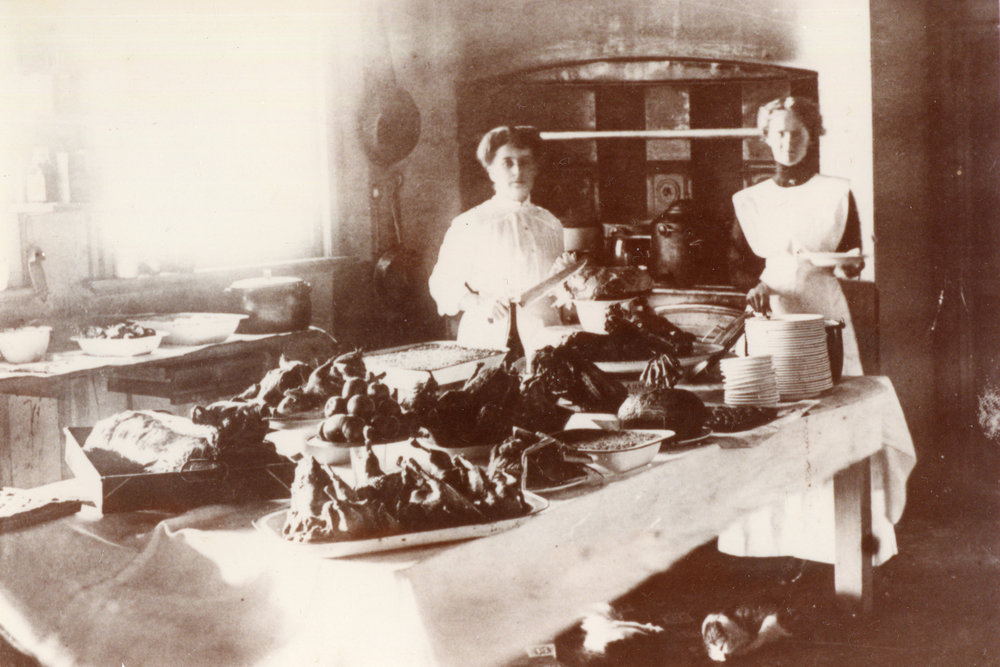 Rene and Flo McCristal prepare Christmas dinner at the Pier Hotel, 25 December 1910