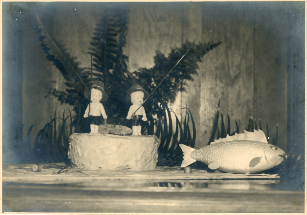 Cake topper porcelain dolls land a fish