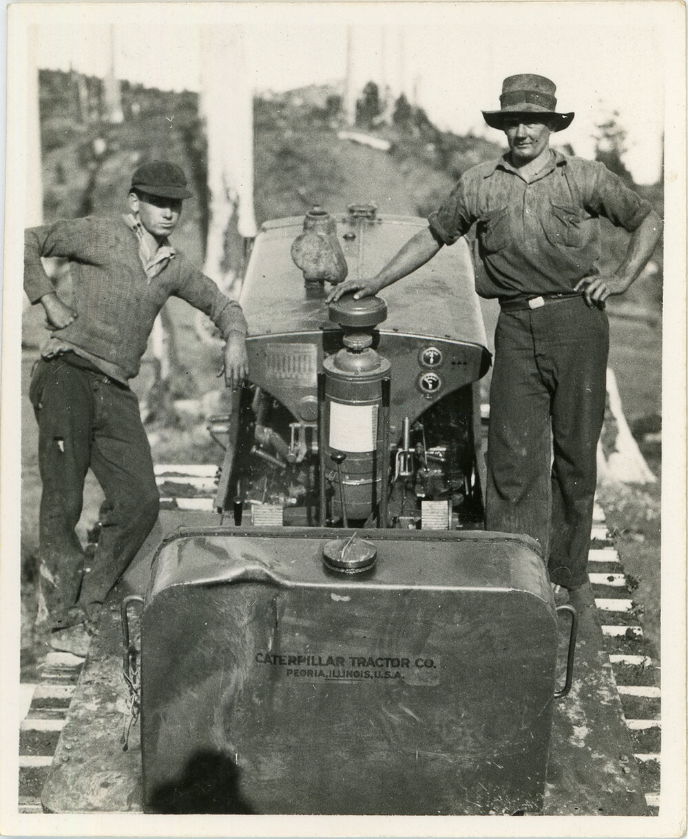 Workers stand on the Caterpillar, 1936