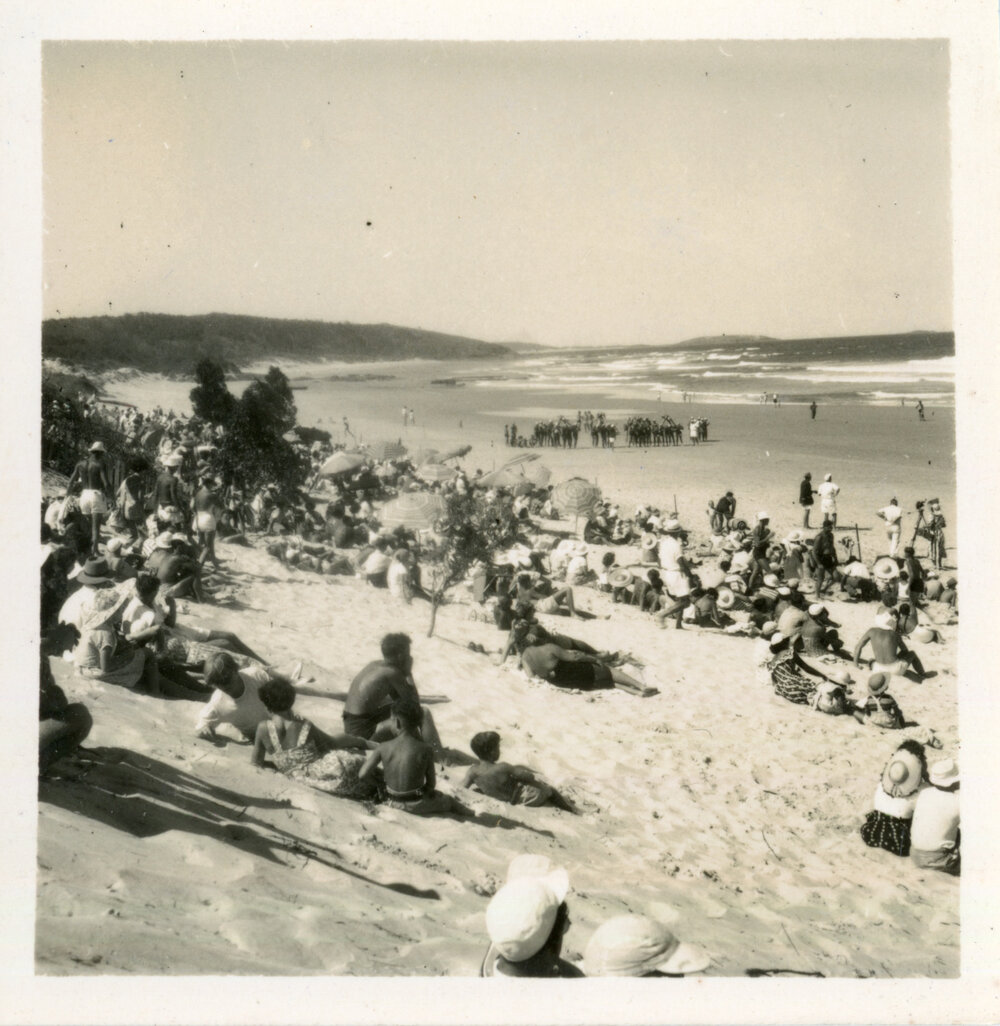 Crowds and officials watch the surf carnival