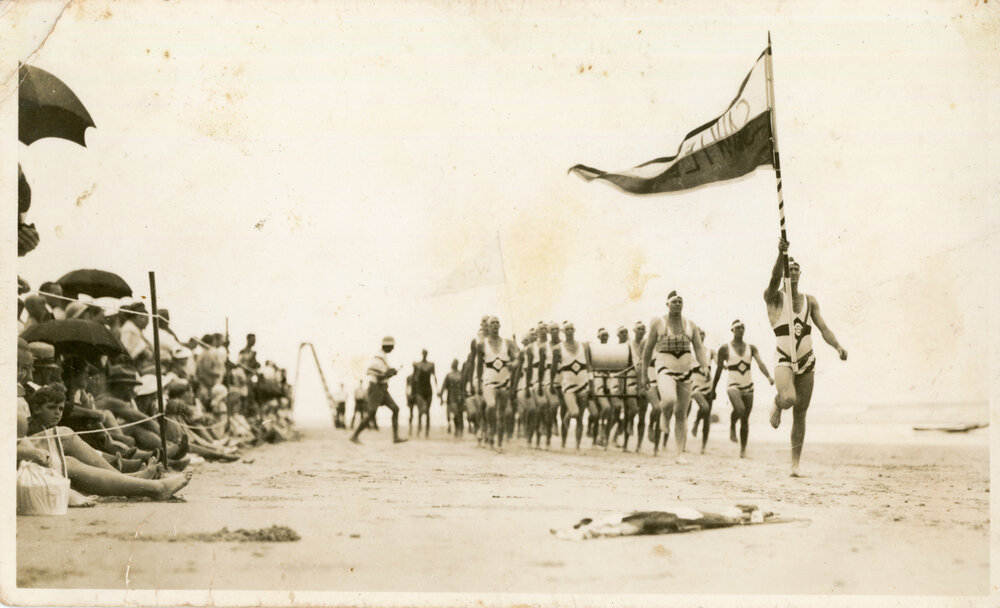 Men's surf-lifesaving team march past