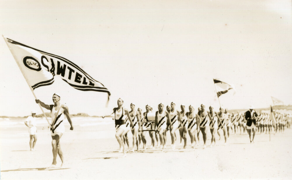 Surf life-savers march past