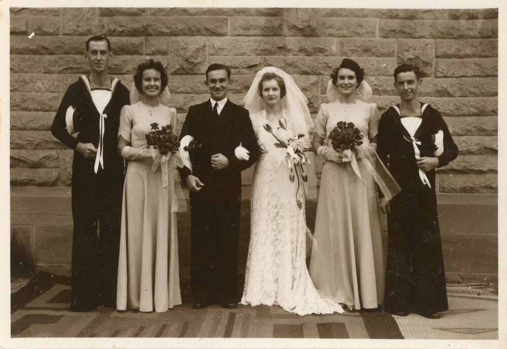 Portrait of a bridal party with naval officers