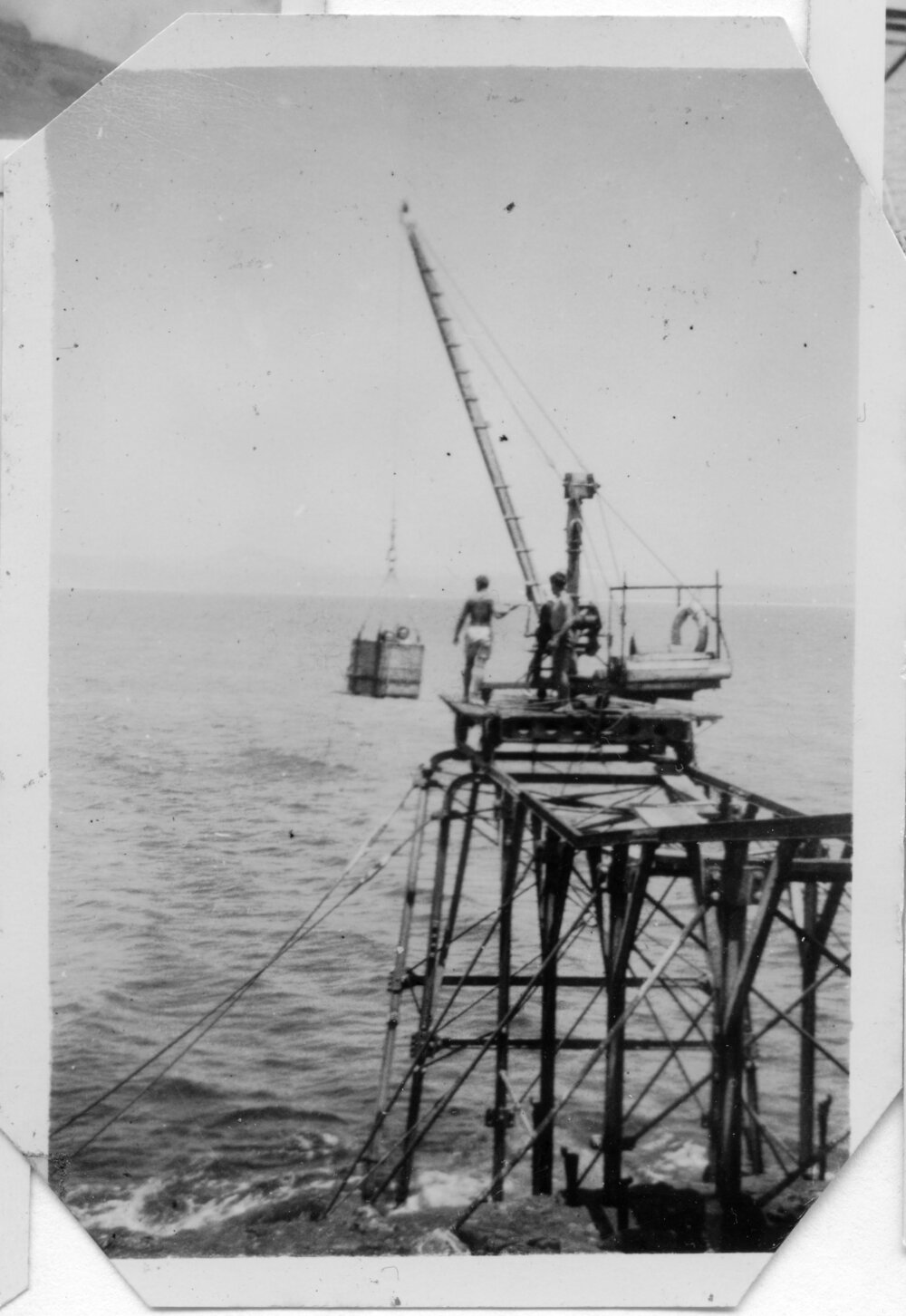 Winching up the basket of supplies at South Solitary Island jetty, early 1950s