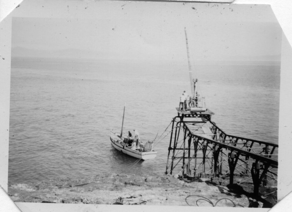 The supply boat leaving South Solitary Island, early 1950s