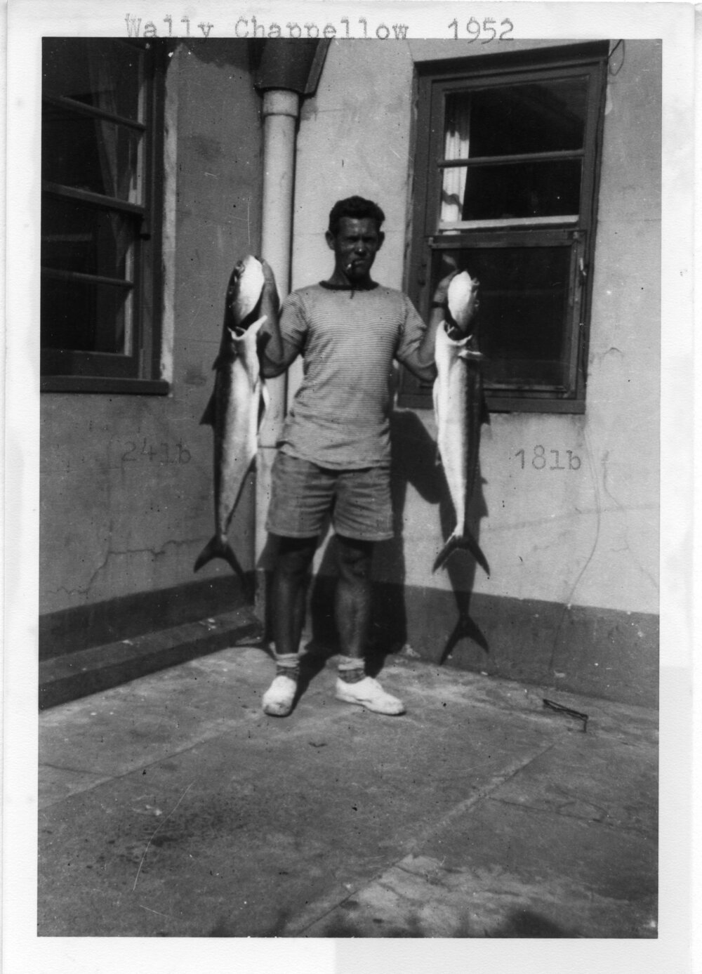 Lightkeeper Wally Chappelow with fish, 1952