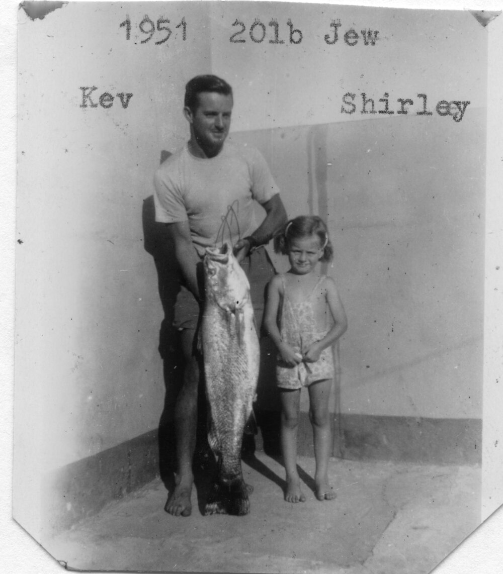 Lightkeeper Kevern Hobman and Shirley with fish, 1951