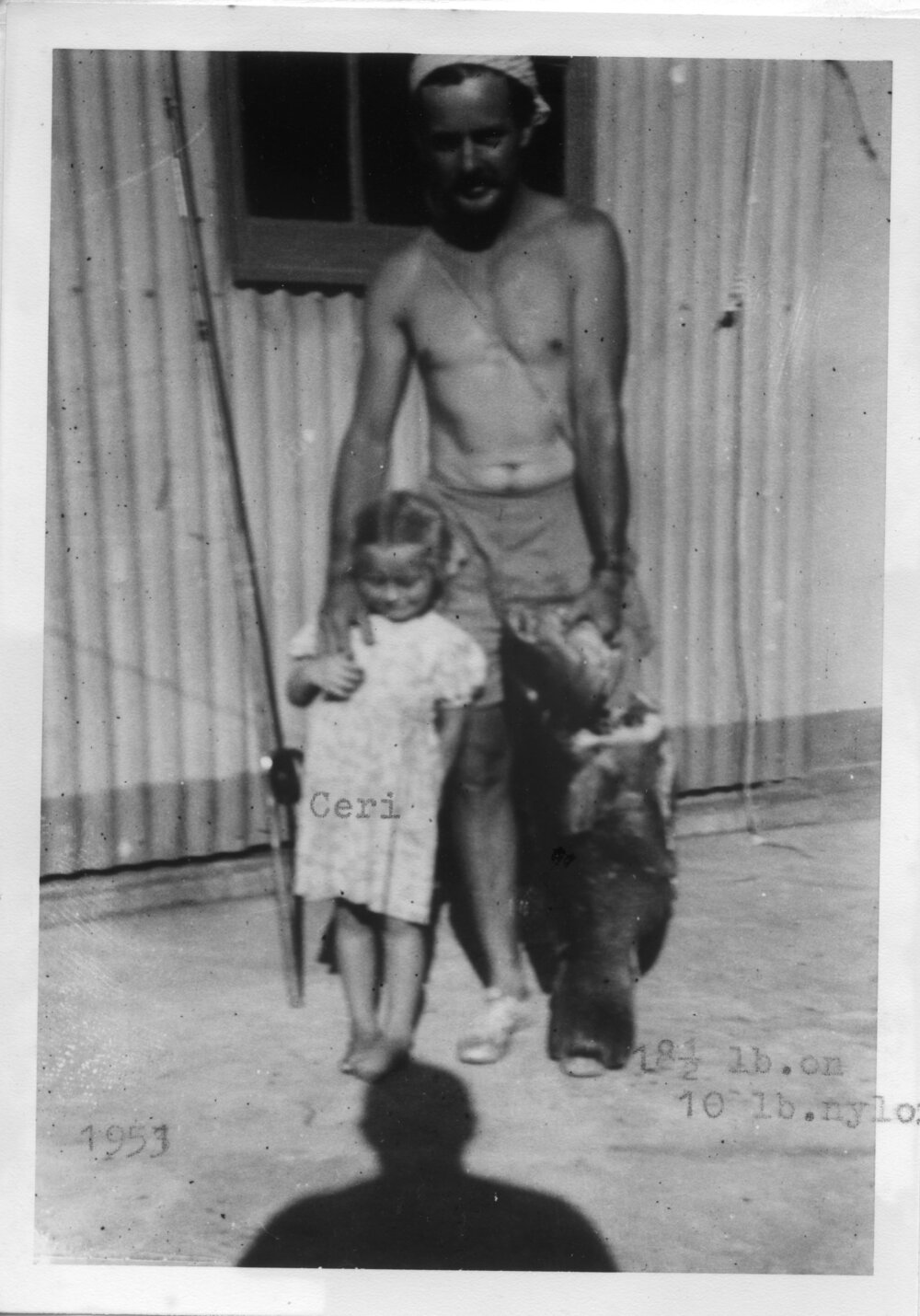 Lightkeeper Kevern Hobman and Ceri with fish, 1953 - 1954