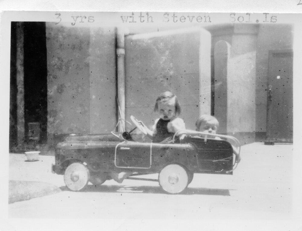 Linda Hobman and her brother Steven in their pedal car at Seal Rocks, 1954