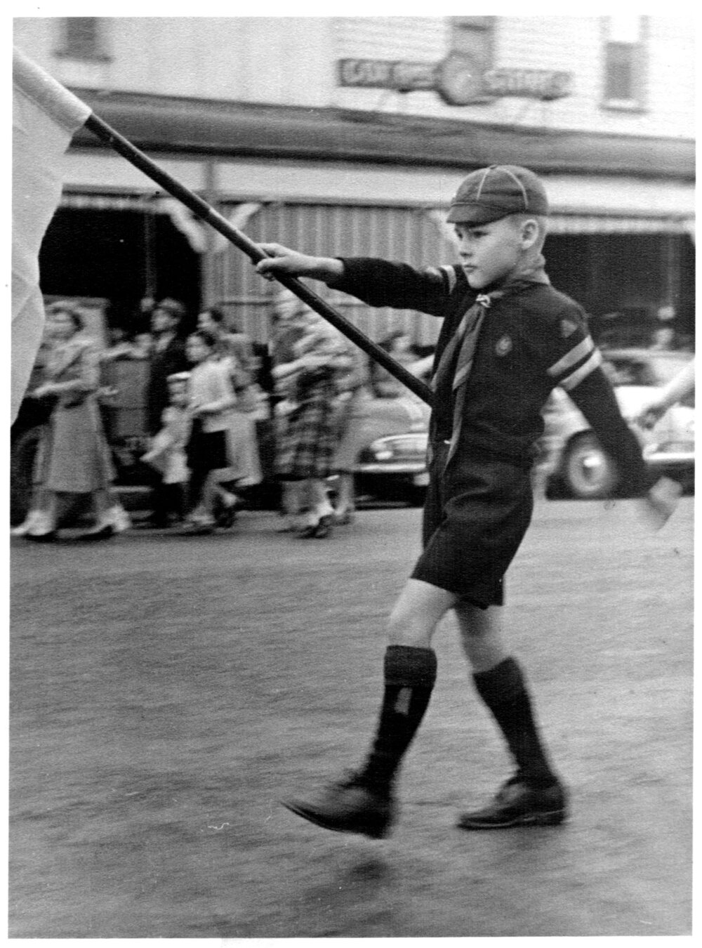 Coffs Jetty Boy Scout Hugh Nicol as leading flag holder, Anzac Day 1950s