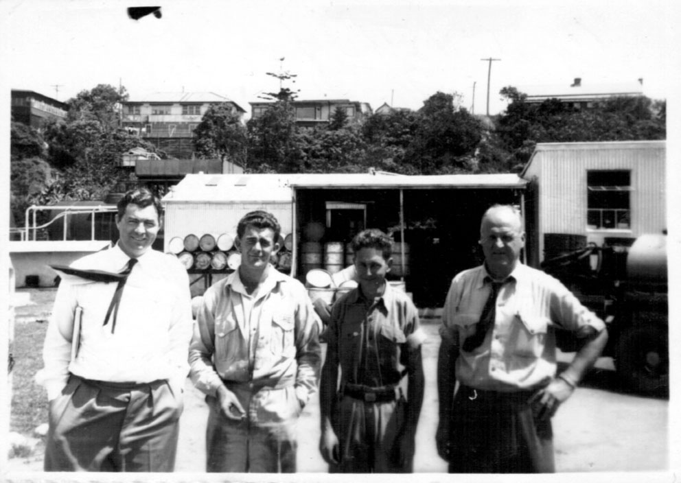 Cyril Nethery, Trevor O'Neill, Neville Budge and David Nicol at the Coffs Jetty Shell depot, 1950s