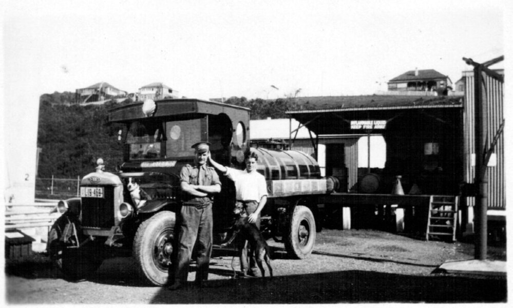 David Nicol and co-worker beside the Denis 600 gallon fuel tanker at the Coffs Jetty Depot, 1930s 