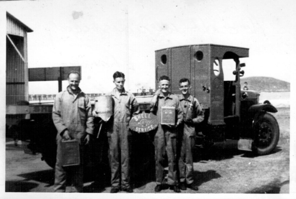 David Nicol with Sid Cockle and crew at the Shell Depot near Coffs Jetty, 1930s