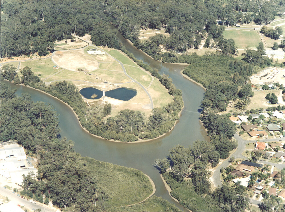 Aerial view of the developing Botanic Garden and Coffs Creek, August 1990